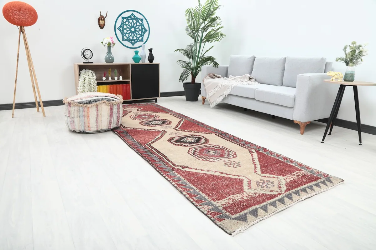 Angled view of the rug in a room setting, highlighting its placement in a hallway or narrow area.