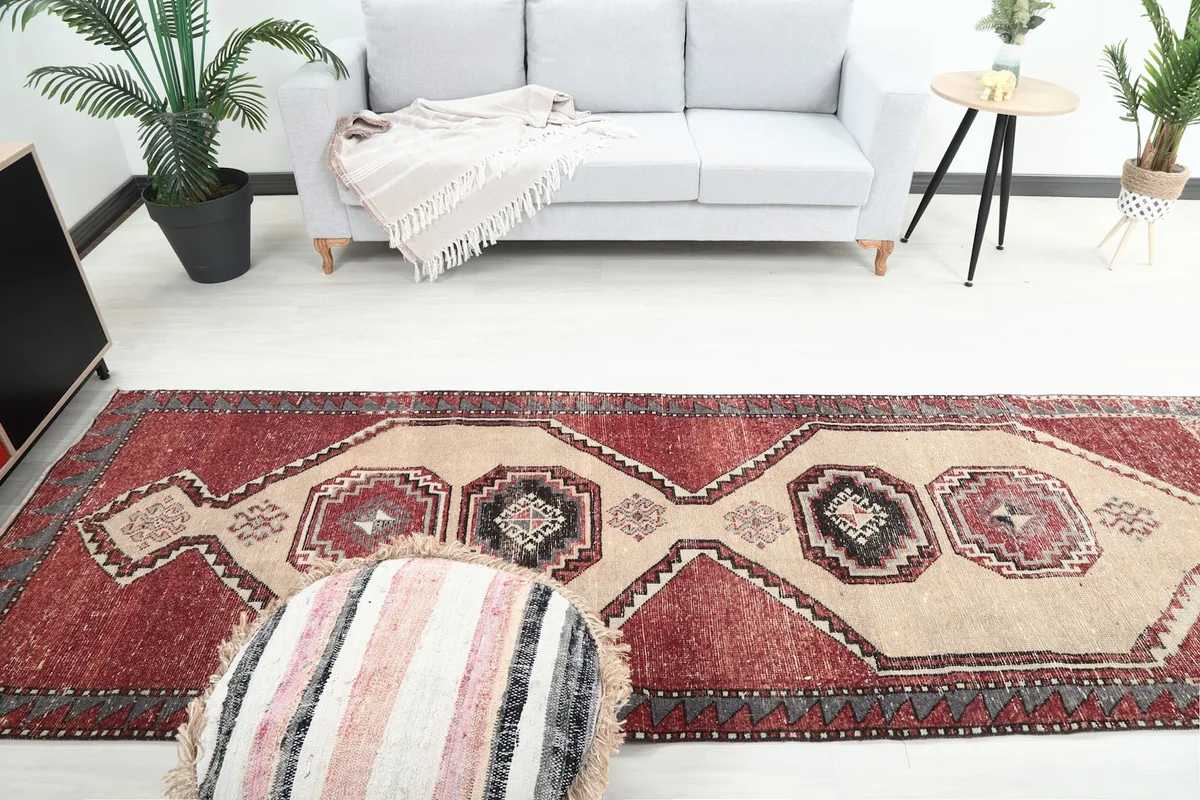 Overhead view of the runner rug in the room, showing its full length relative to the furniture.