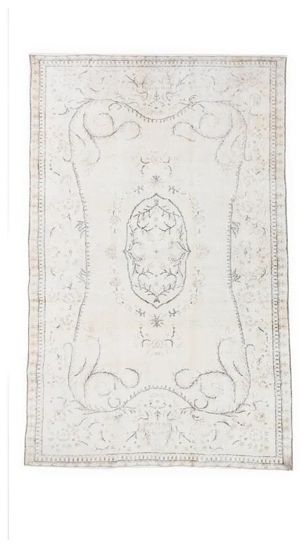 Full top view of the ivory and gray vintage Anatolian rug with medallion and floral patterns.