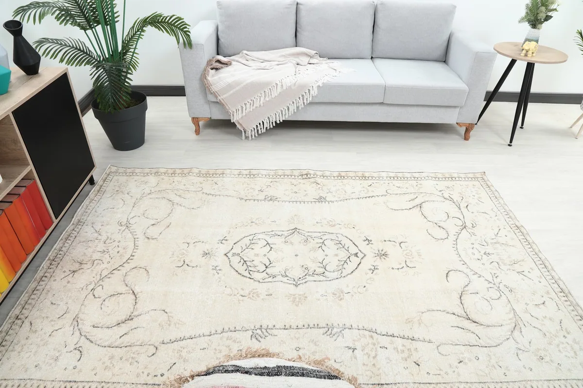 Overhead view of the rug on the floor, highlighting the central medallion and overall design.