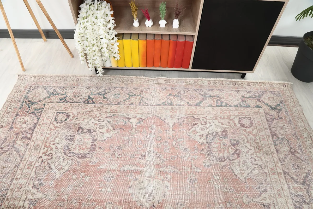 Angle view of the vintage Anatolian rug showing its placement relative to a console table