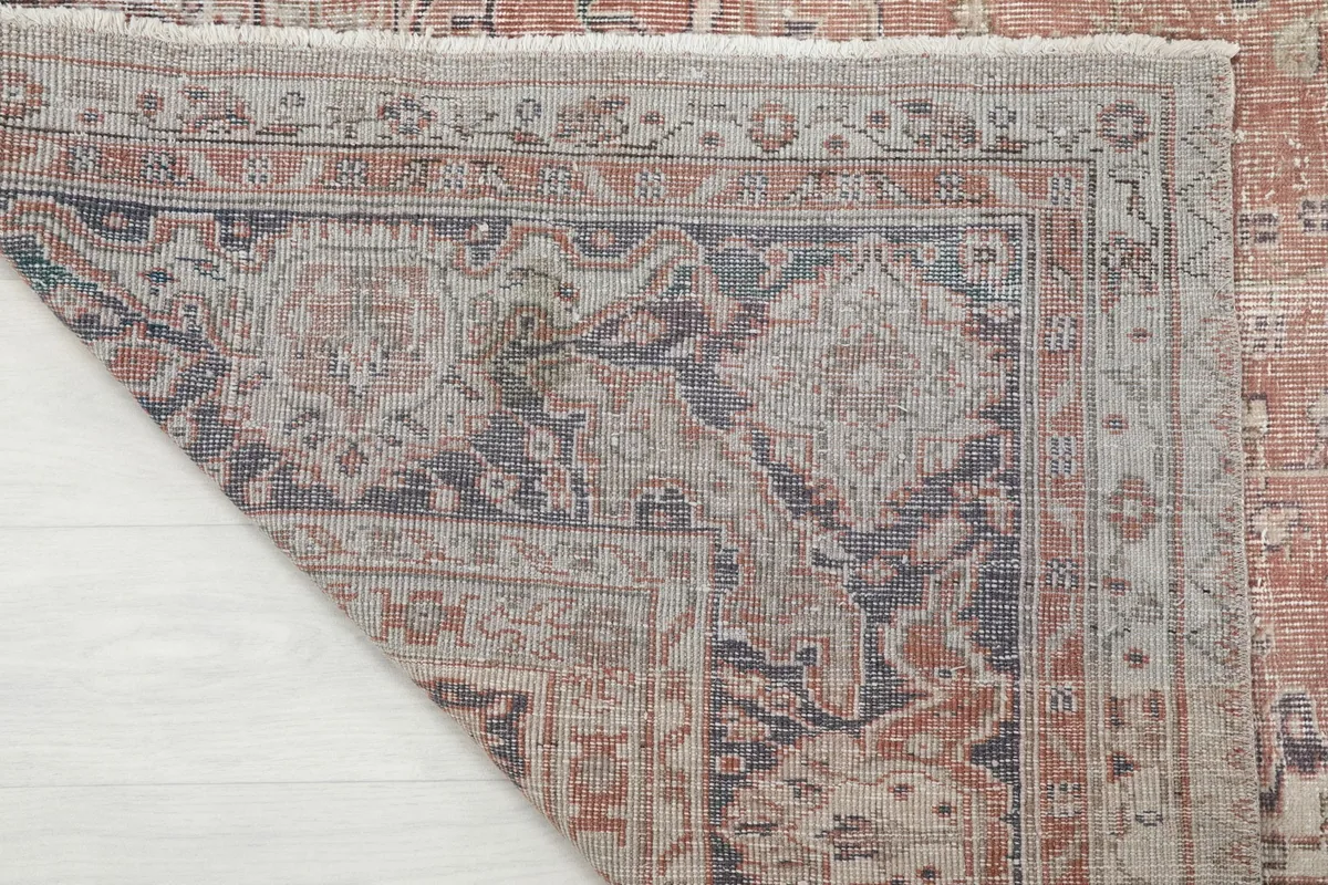 Close-up of the back of the hand-knotted wool rug, revealing the tight weave and foundation