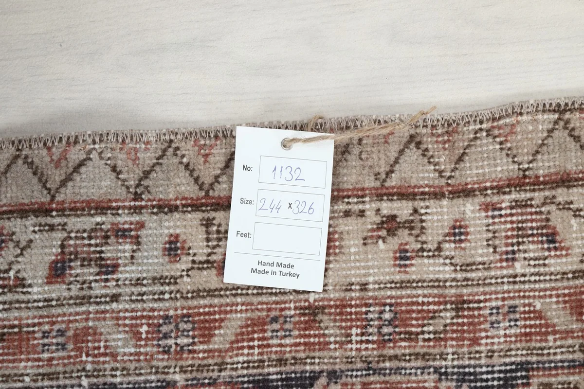 Tag on the back of the rug displaying size 244 x 326 cm, confirming hand-made in Turkey