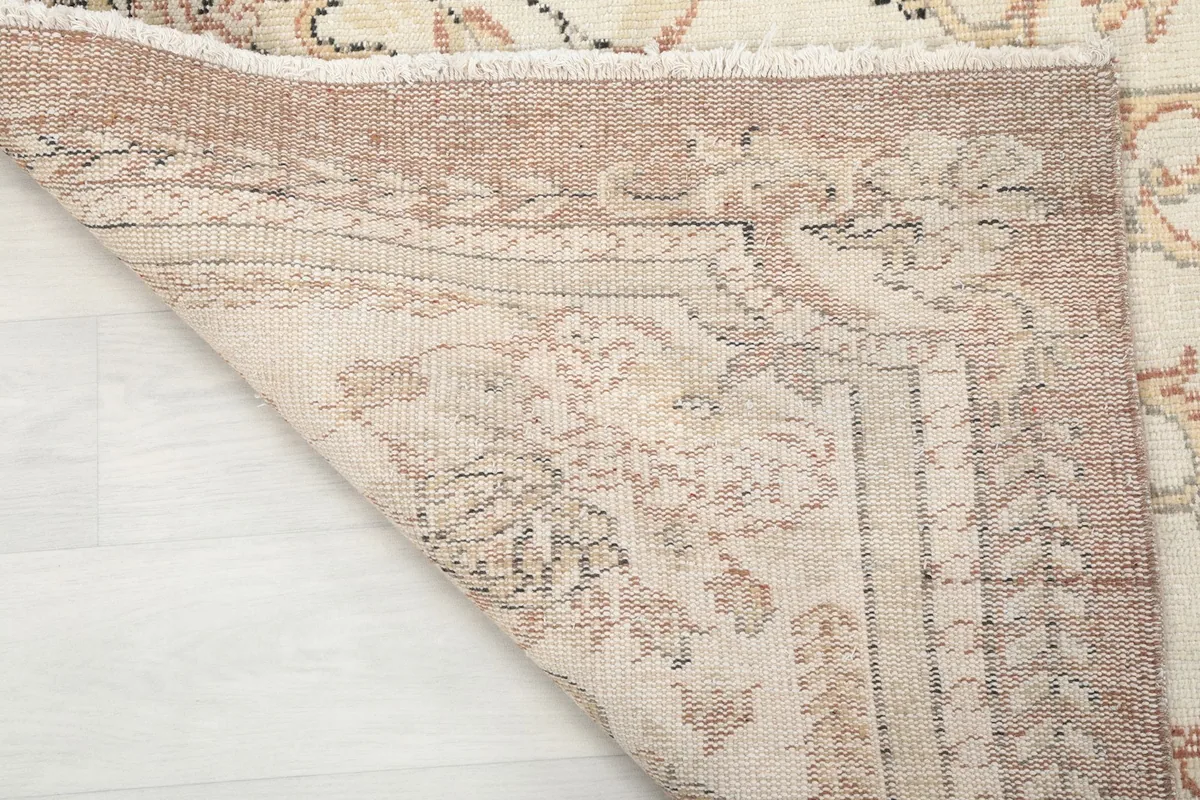 Underside of the rug showing the tight weave of the cotton foundation and wool knots