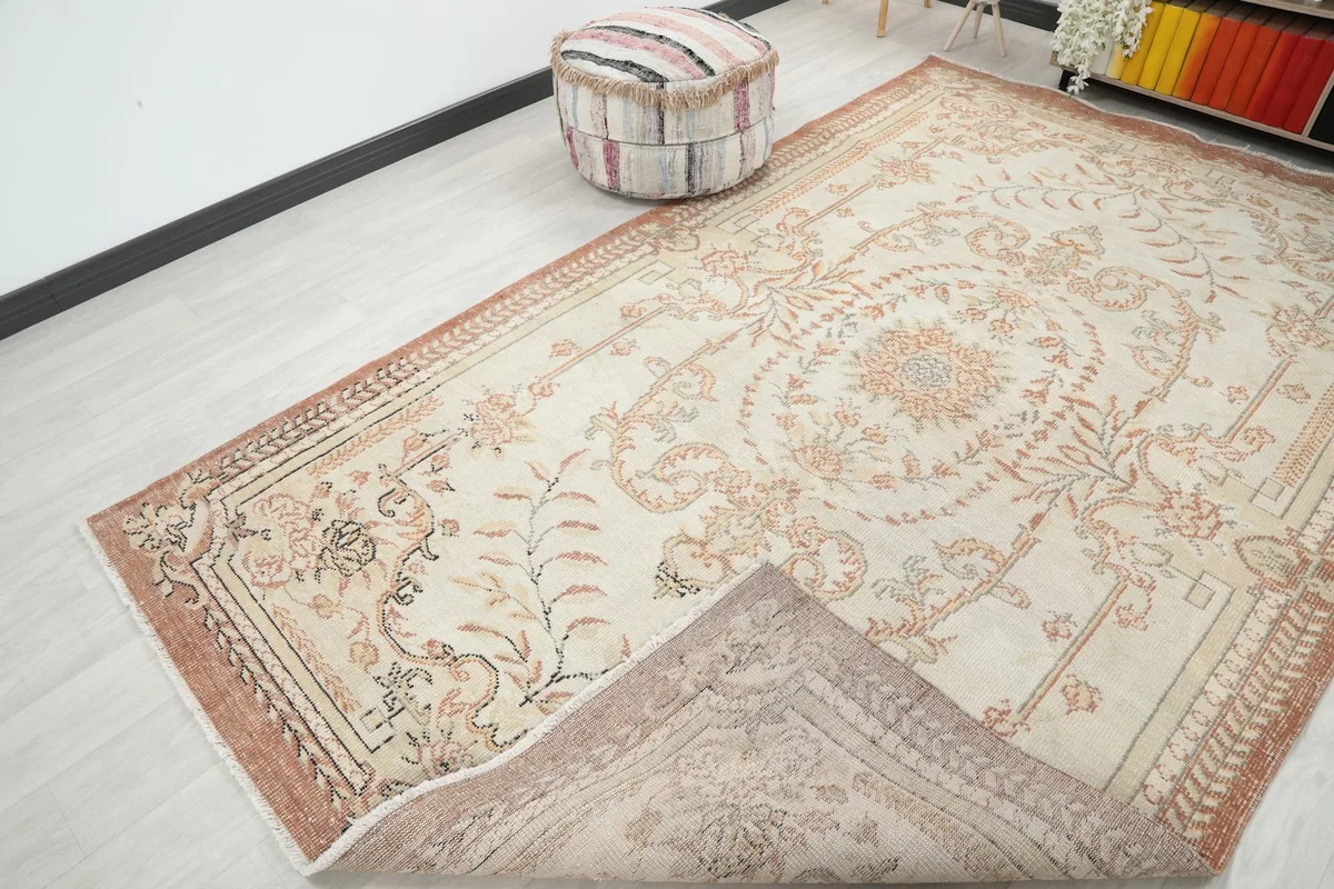Rug corner folded to reveal the cotton foundation and hand-knotted construction