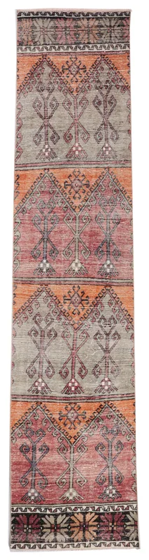 Full top view of the vintage Anatolian runner rug with rust, gray, and black geometric patterns