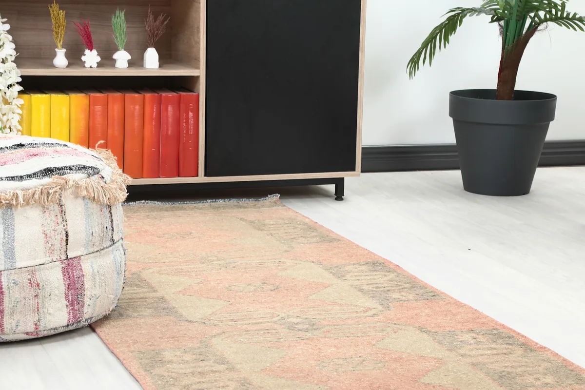 Close-up of the runner rug's end in a room, showing its blend with modern decor.