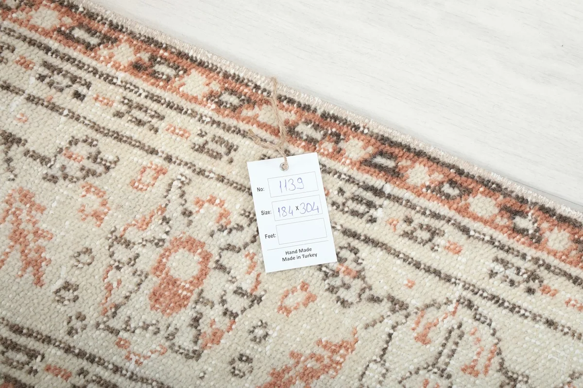 Close-up of the rug's label indicating its origin from Turkey and size in cm