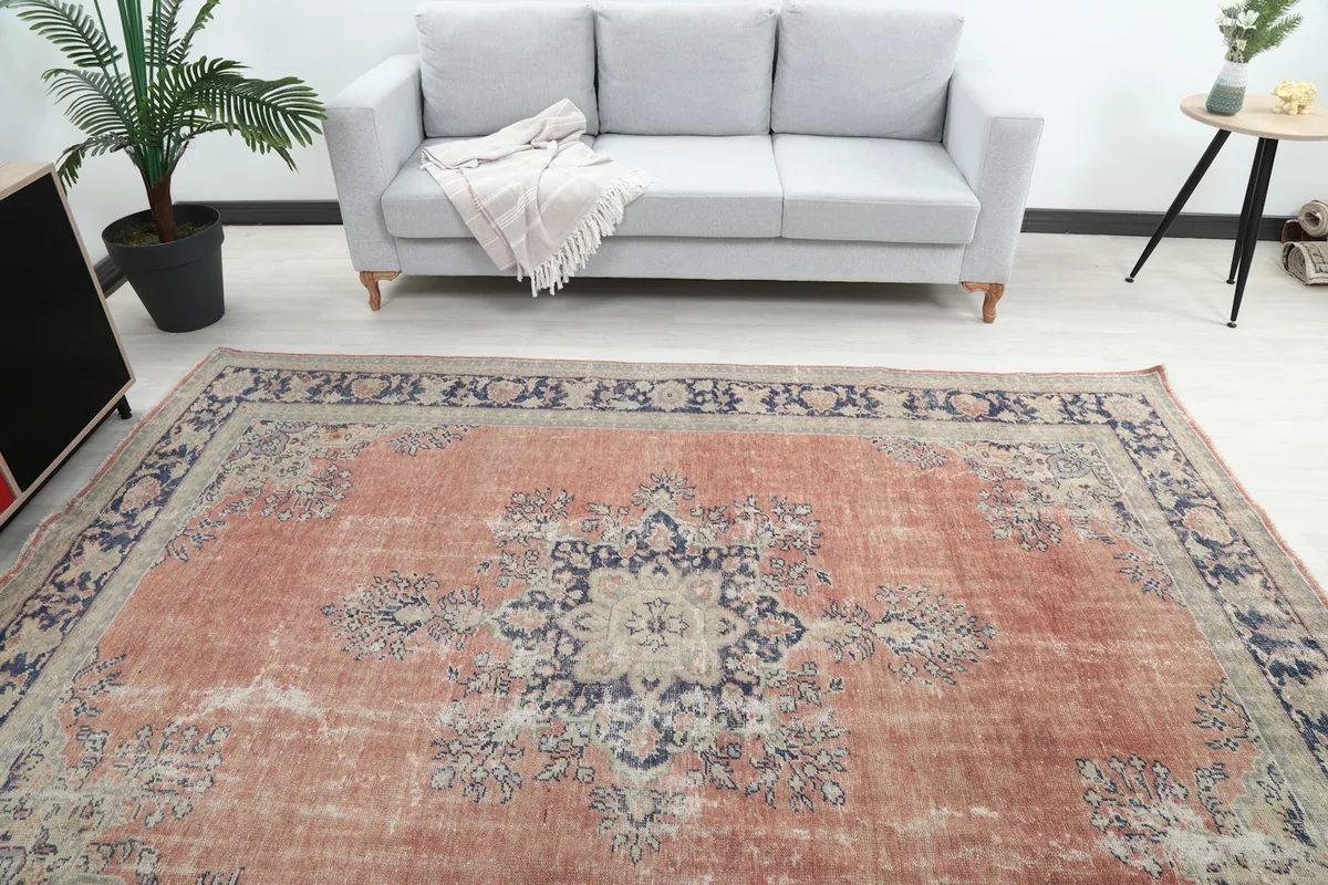 Overhead view of the rug in a living room, showing its placement in front of a gray sofa
