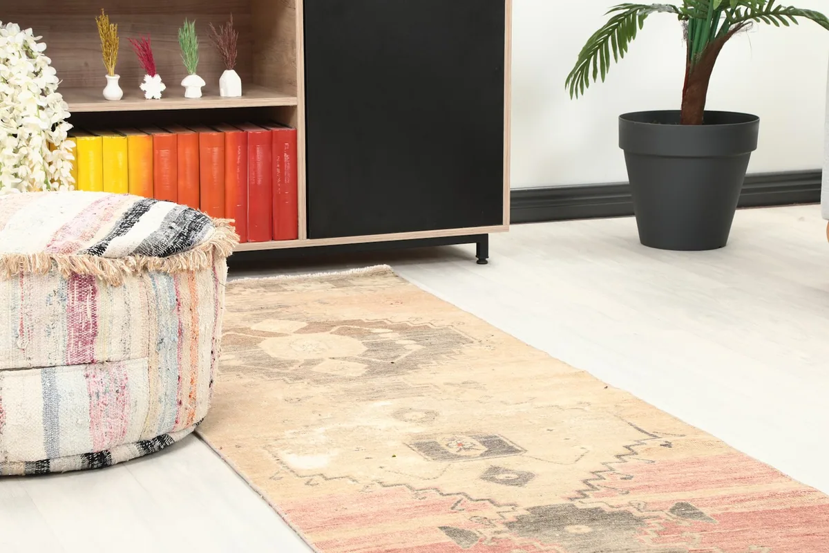 Close-up of the rug's mid-section in a room, showing its blend with surrounding furniture.