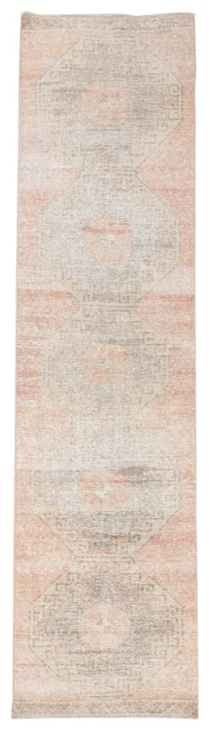 Full top view of the 2'9" x 10'9" muted rose and gray geometric runner rug on a white background