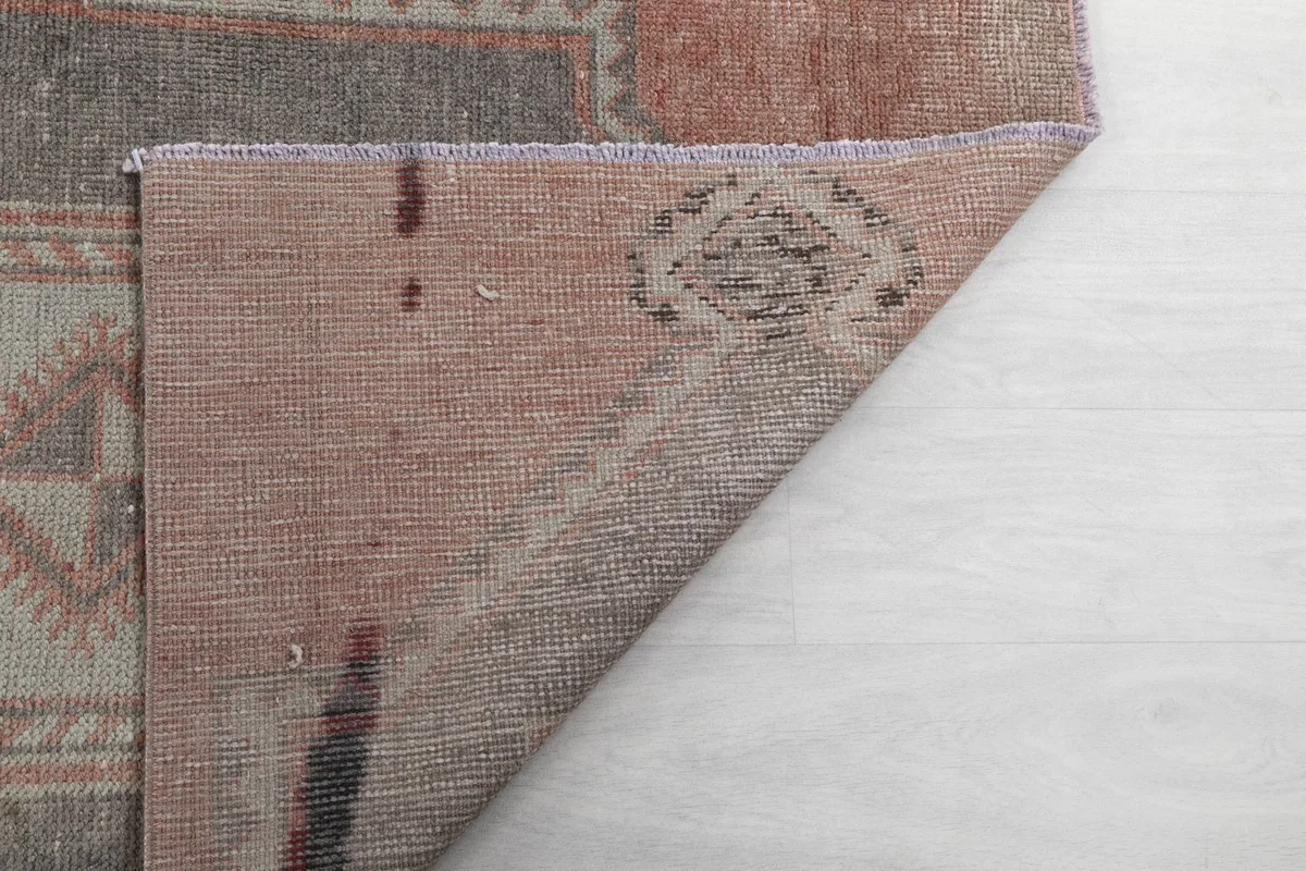 Underside of the runner rug, showing the hand-knotted construction