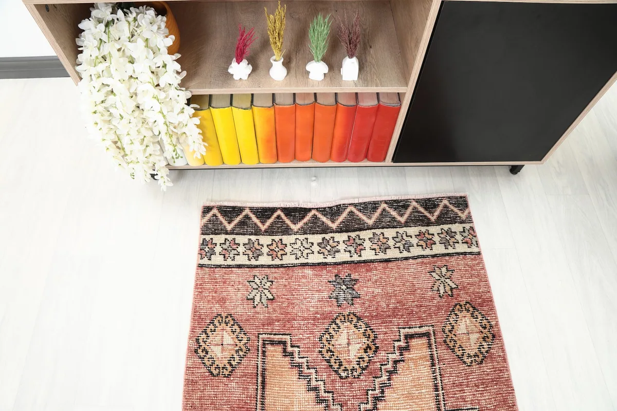 Top-down view of one end of the rug, highlighting border details and colors