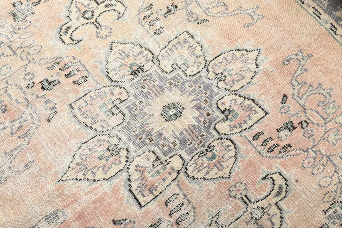 Close-up on the intricate details of the medallion design and color variations