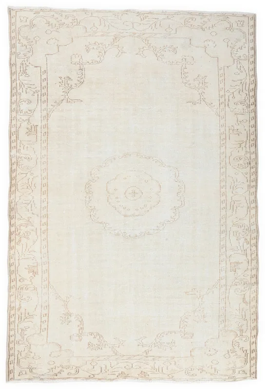 Full top view of the 5'10" x 8'6" ivory and beige vintage Anatolian wool rug on a white background.