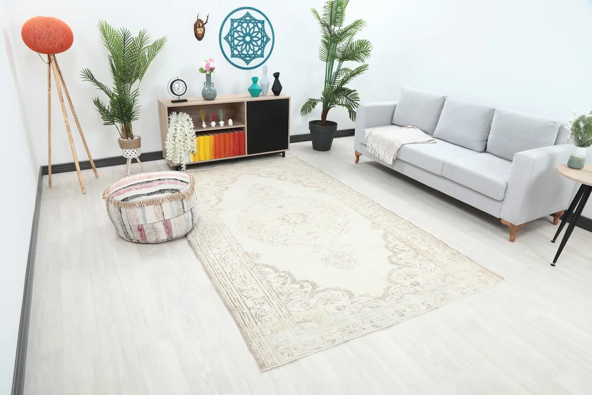 Angle view of the vintage Anatolian rug showcasing its size and placement in a living space.