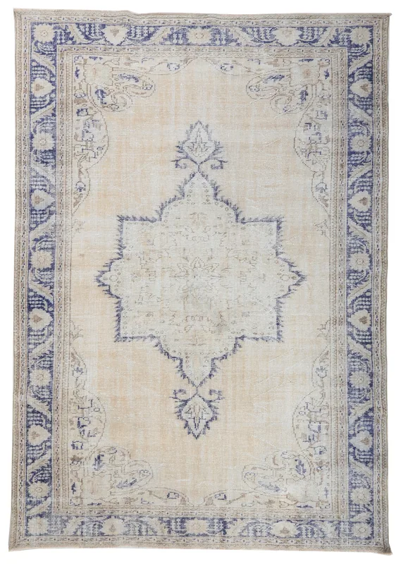 Full top view of a beige and blue vintage hand-knotted Anatolian area rug