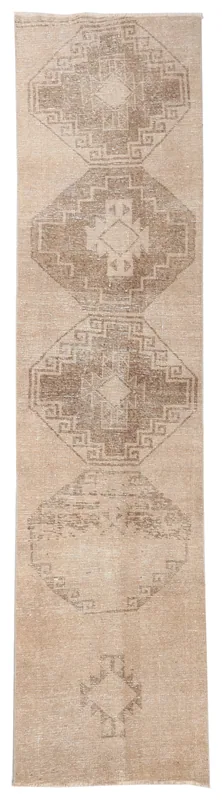 Full top view of the 2'8" x 11'5" tan and brown geometric Anatolian runner rug on a white background.