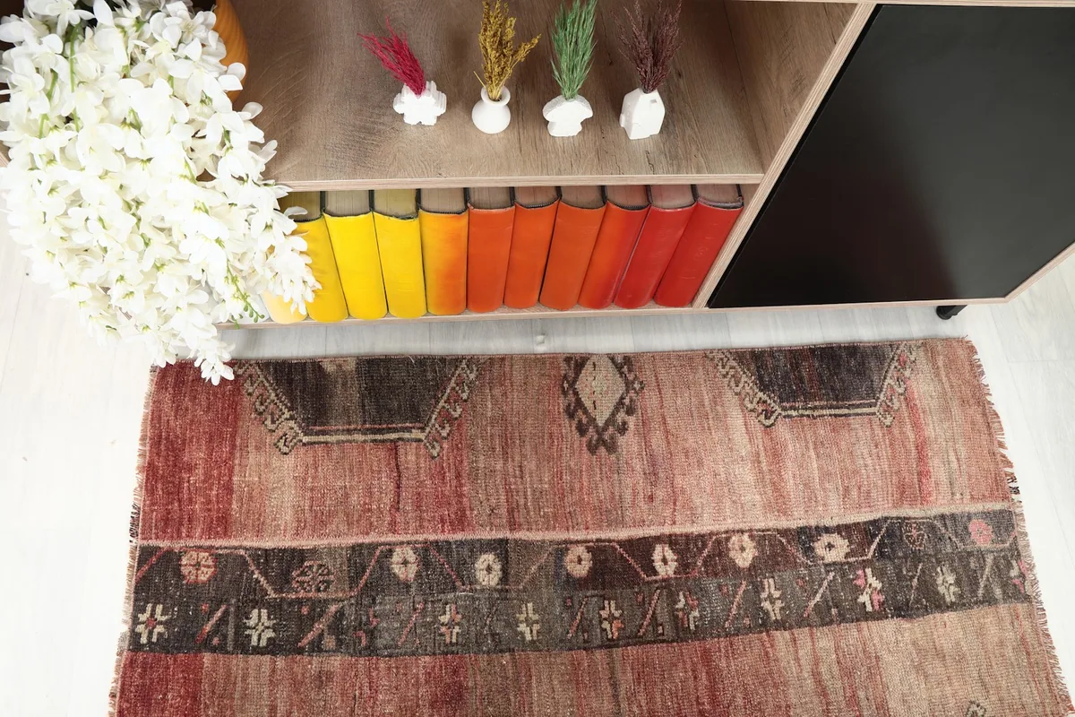 Direct overhead shot of the center and top half of the rug, highlighting its pattern and colors