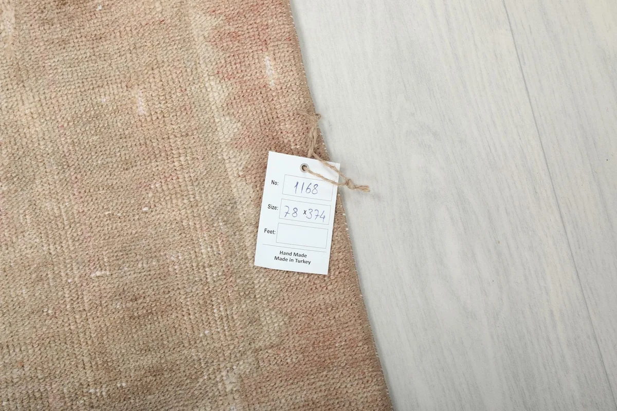 Close-up of the rug's label, indicating its handmade origin from Turkey