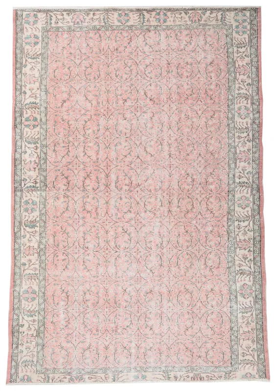 Full overhead view of the 6x9 rose and gray Anatolian rug on a white background
