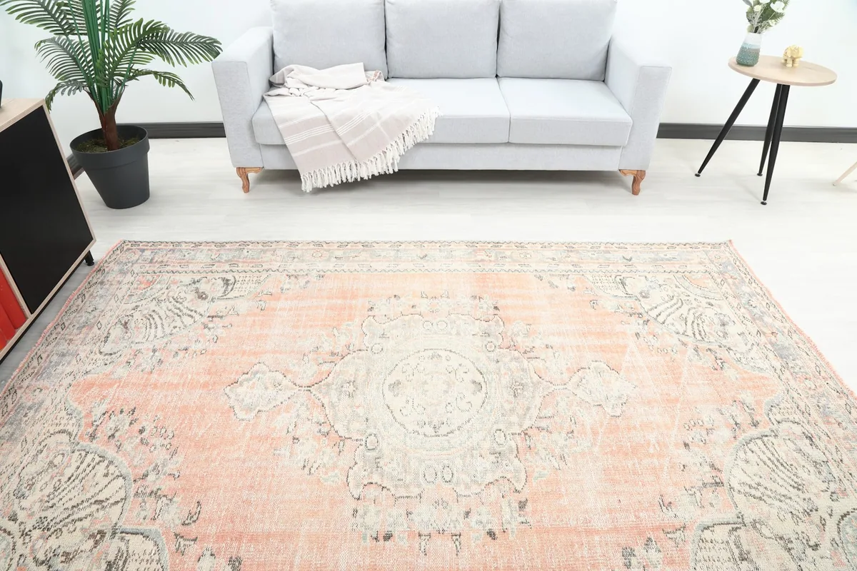Overhead view of the vintage rug in a room, highlighting the central medallion design