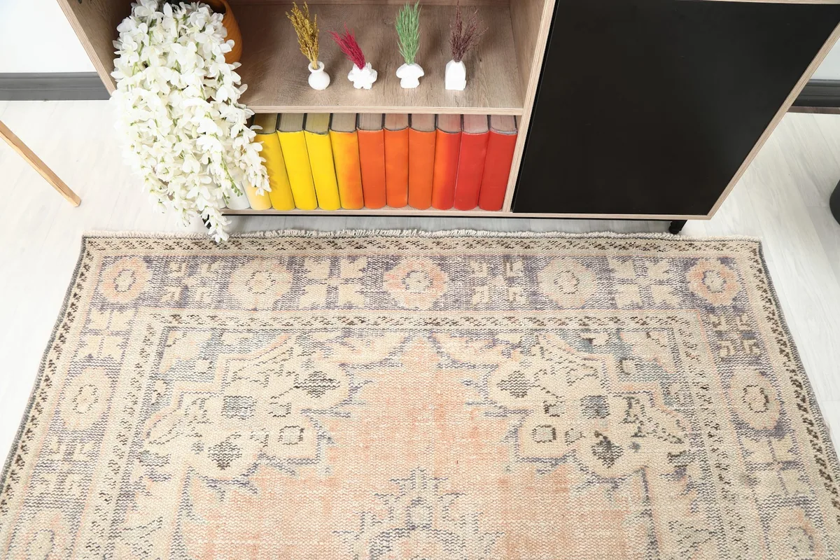 Angled overhead shot focusing on the top portion of the rug and its border details