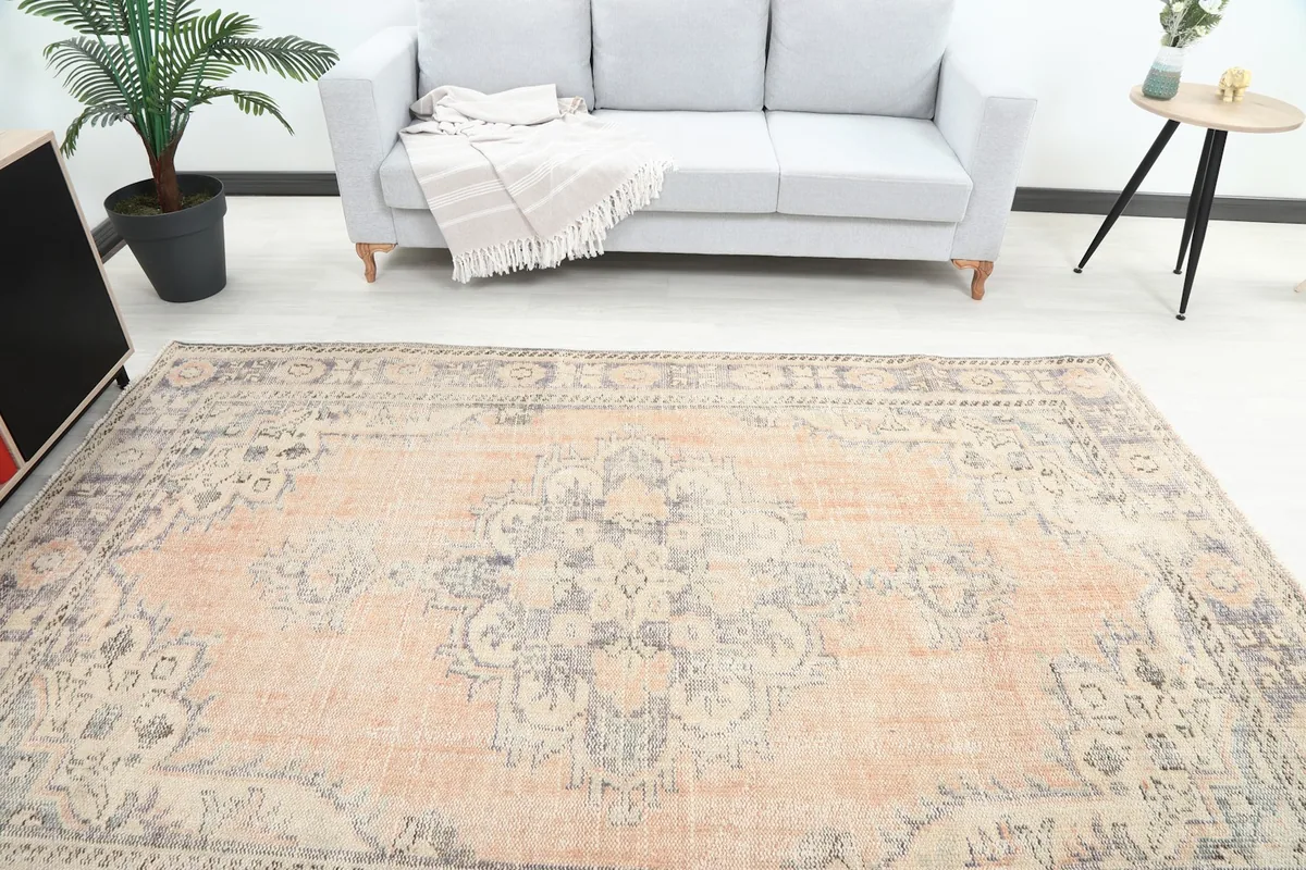 Overhead view of the vintage rug in a living room, showcasing the full design