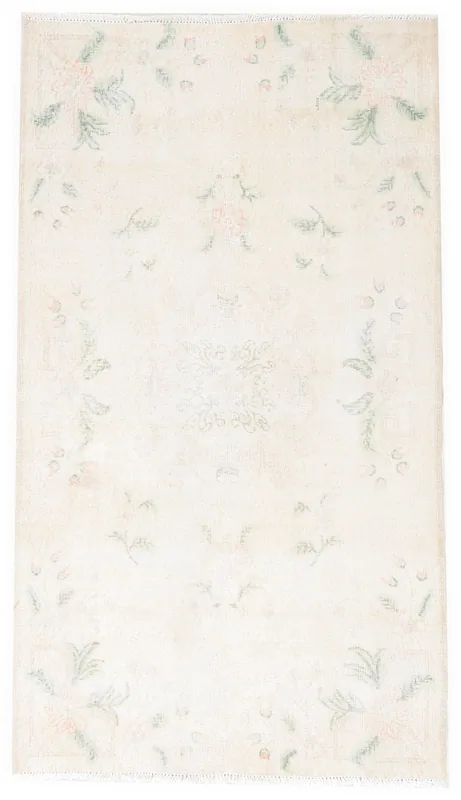 Full top view of a beige vintage Anatolian rug with rose and green floral patterns