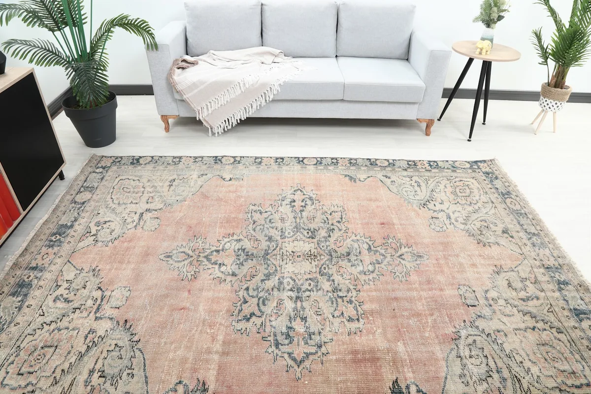 Overhead view of the rug in a room, highlighting the central medallion and overall pattern