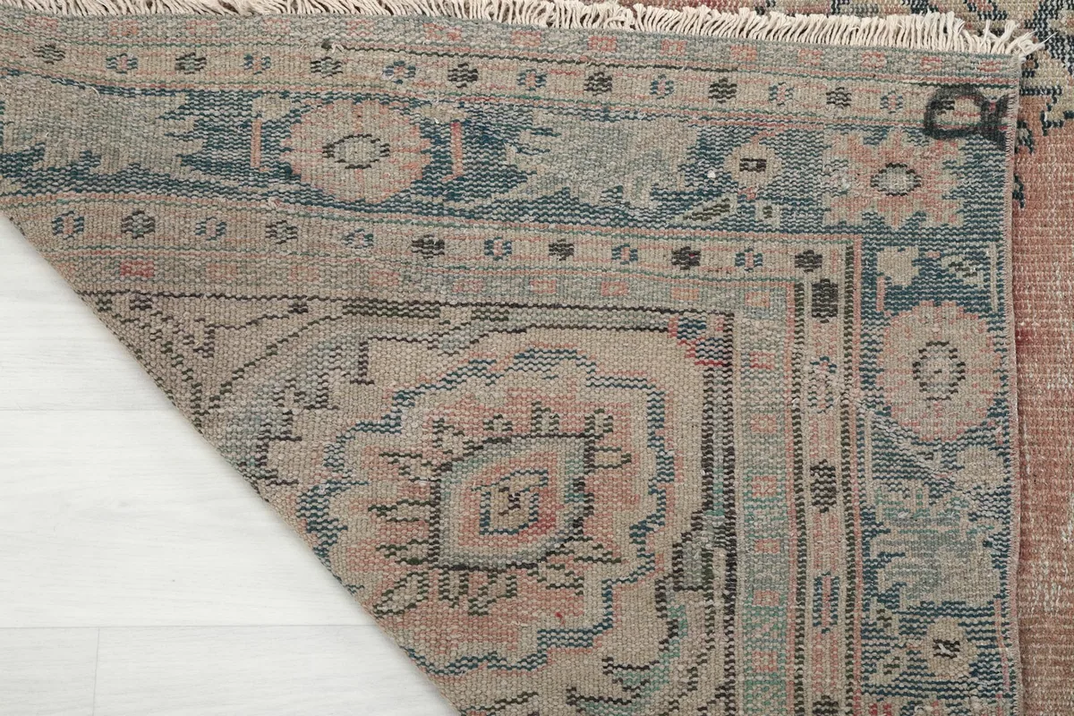 Close-up of the back of the rug, showing the tight knotting and cotton foundation
