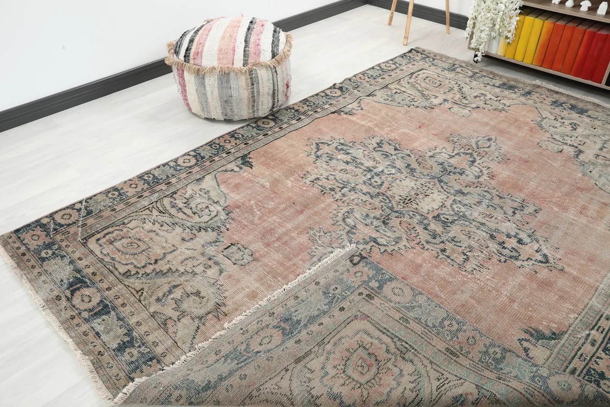 View showing the rug folded back slightly, revealing the underside and the hand-knotted construction