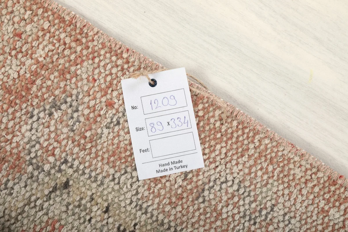 Close-up of the product tag indicating 'Hand Made in Turkey' and the rug's dimensions.