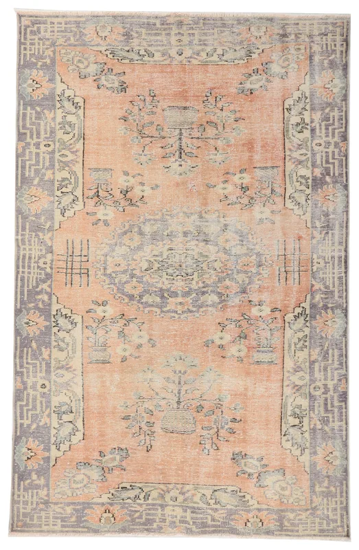 Full overhead view of the 6x9 vintage Anatolian rug with soft orange field and gray border