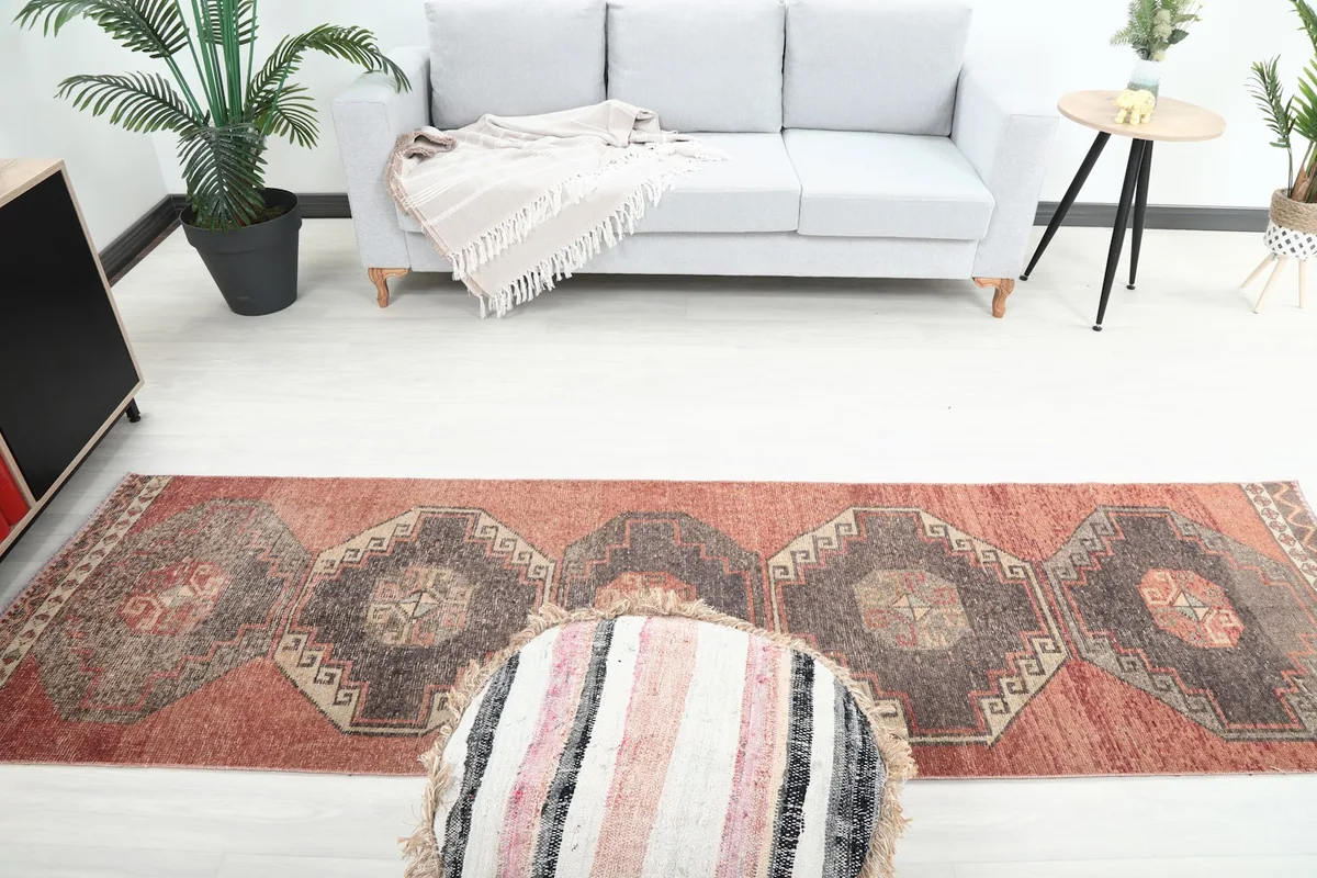 Overhead view of the runner rug in a room, showing the full pattern from above and surrounding furniture.