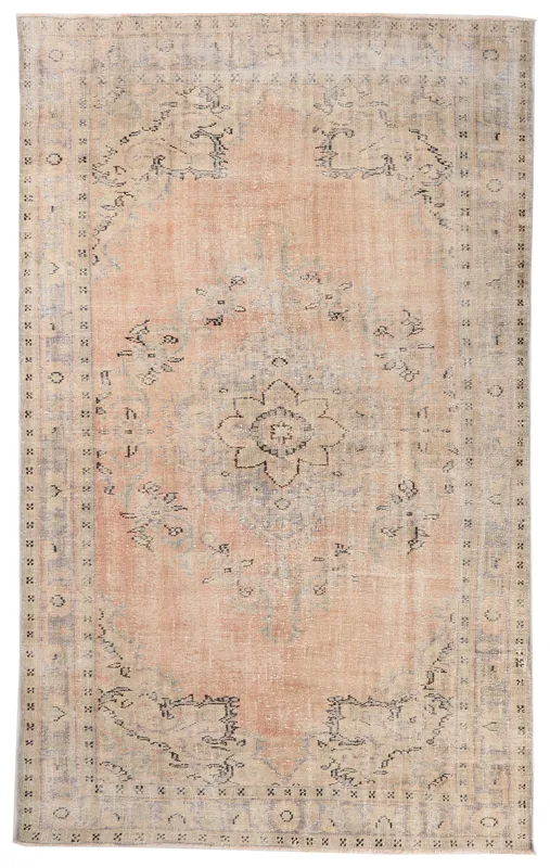 Full overhead view of the 6x10 vintage Anatolian rug with a rose medallion and beige border