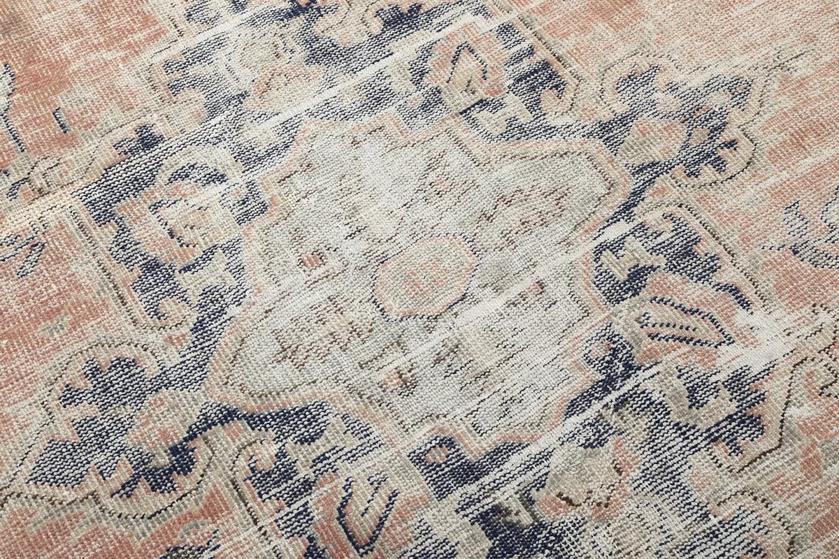 Detailed close-up of the central medallion and surrounding floral-geometric motifs.