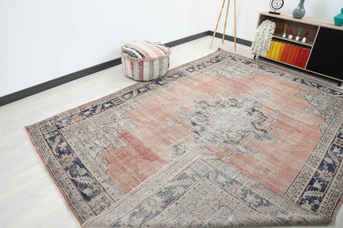 Angled view of the rug with a corner gently folded back, showing its texture and drape.