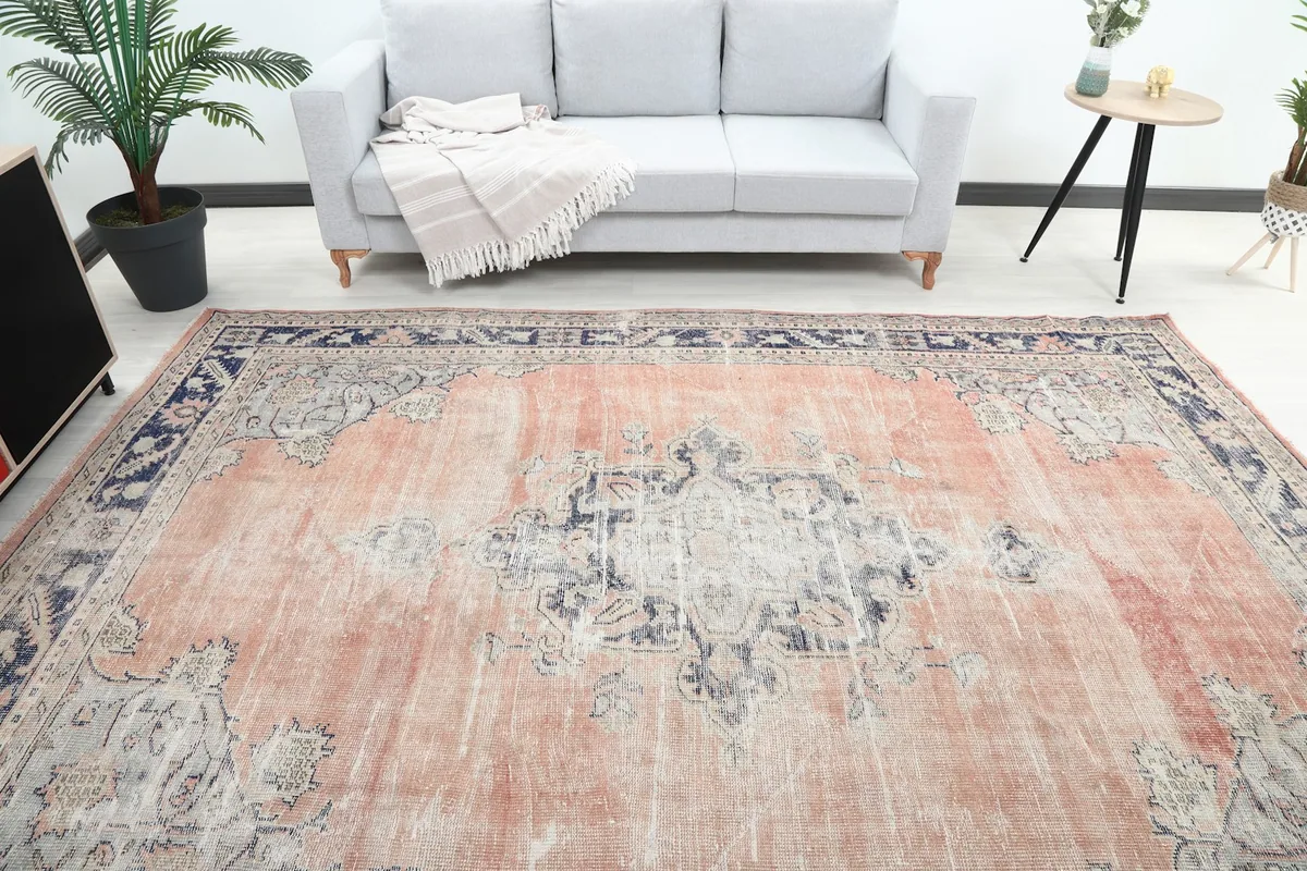 Overhead view of the rug in a room, highlighting the central medallion and overall pattern.