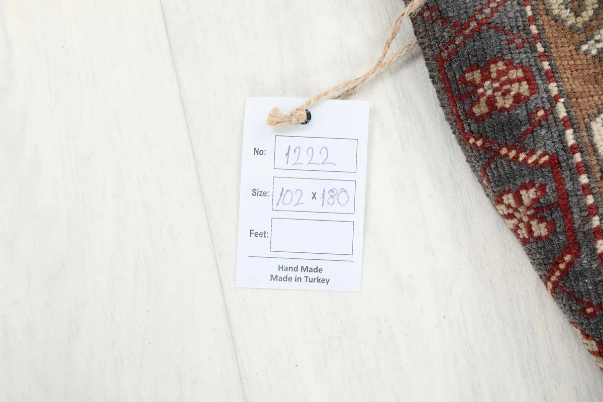 Close-up of the product tag indicating 'Hand Made' and 'Made in Turkey' with size details
