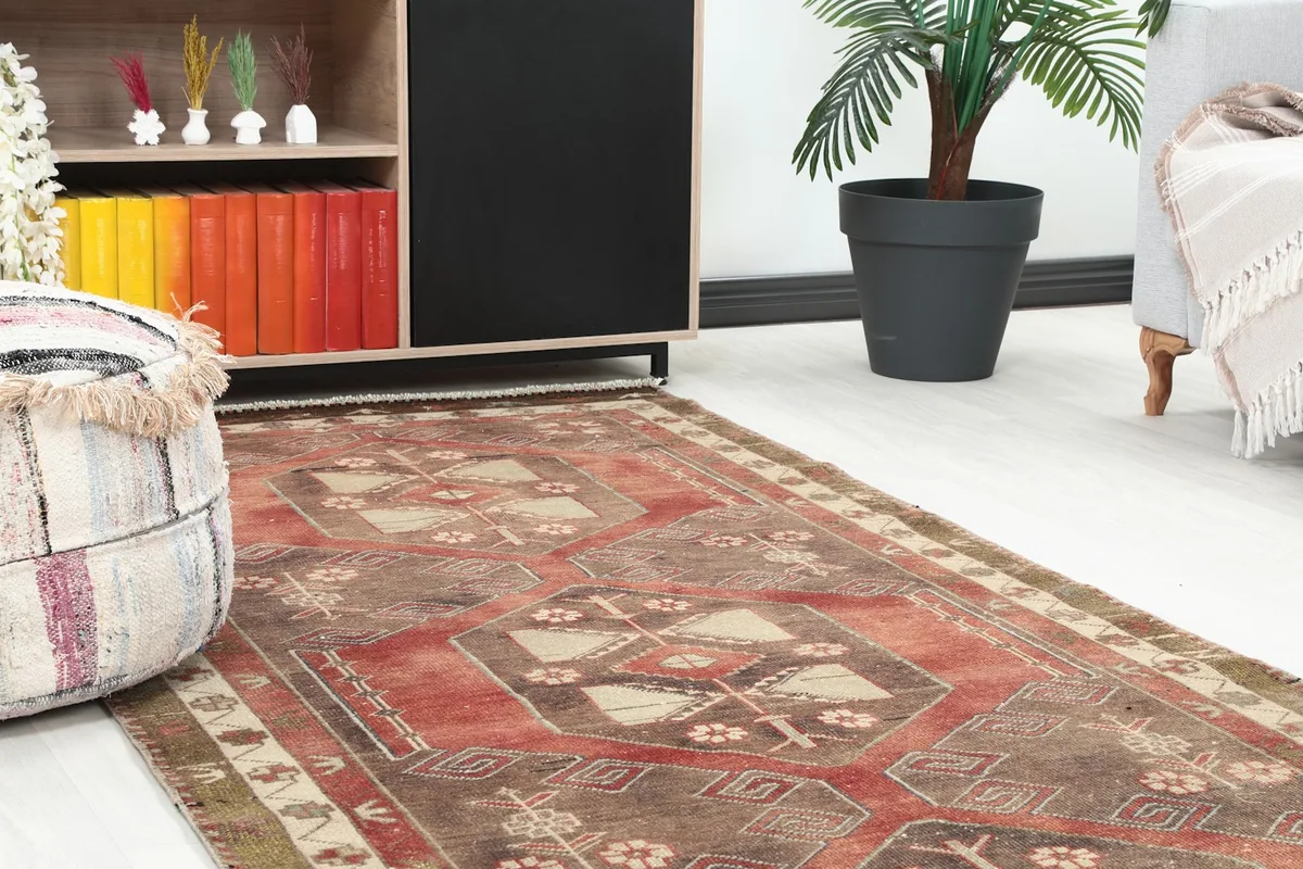 Close-up view of the runner rug in a room setting, highlighting its texture and patterns near a bookshelf