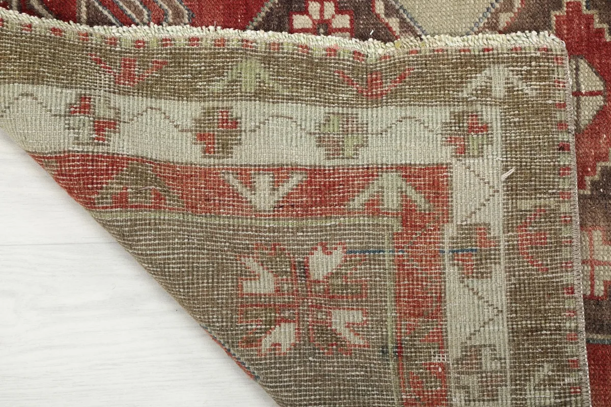 Close-up of the back of the rug, showing the tight hand-knotting and cotton foundation