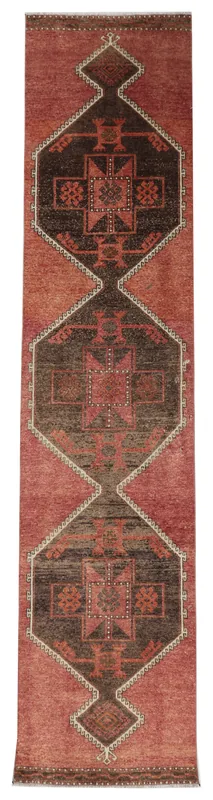 Full top view of the rust and brown geometric Anatolian runner rug on a white background.