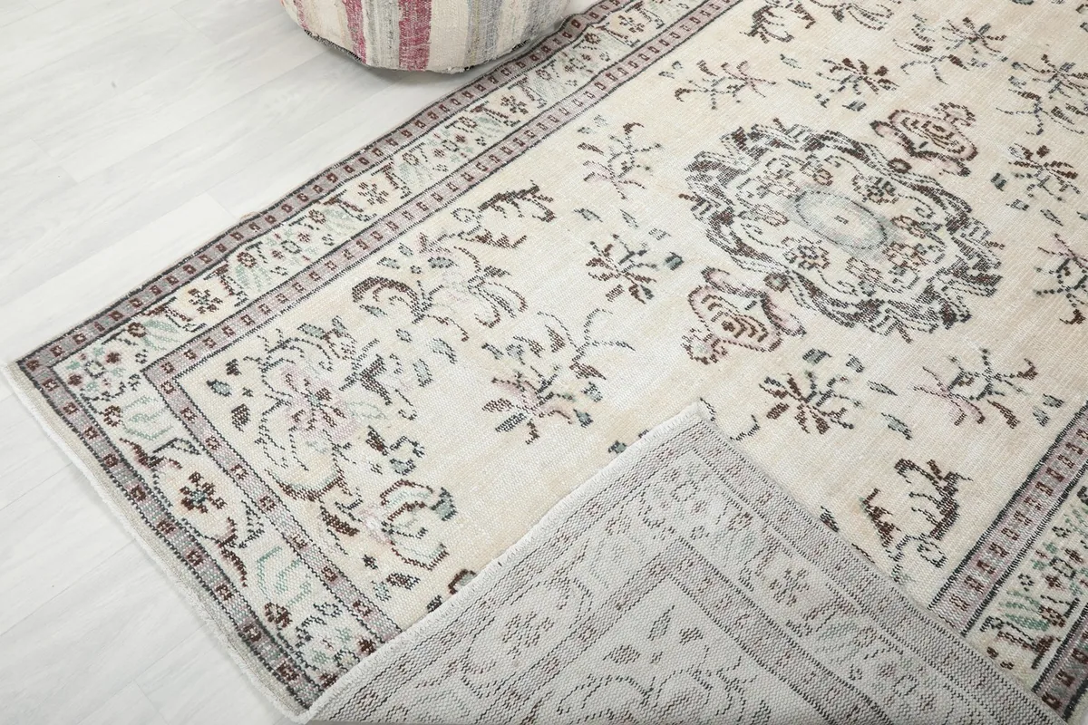 View showing the rug's pile texture and the back of the rug folded over.