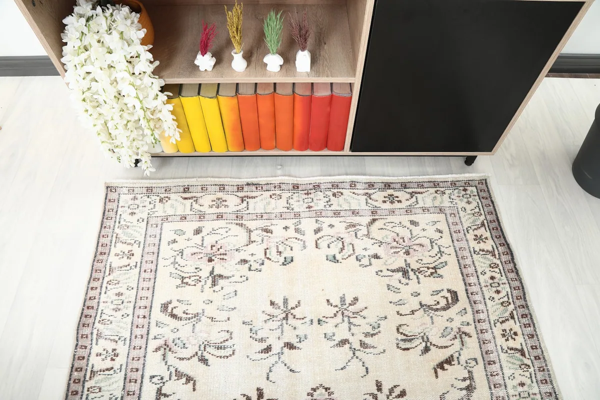 Top-down view of the rug's upper section, highlighting the floral patterns and border.