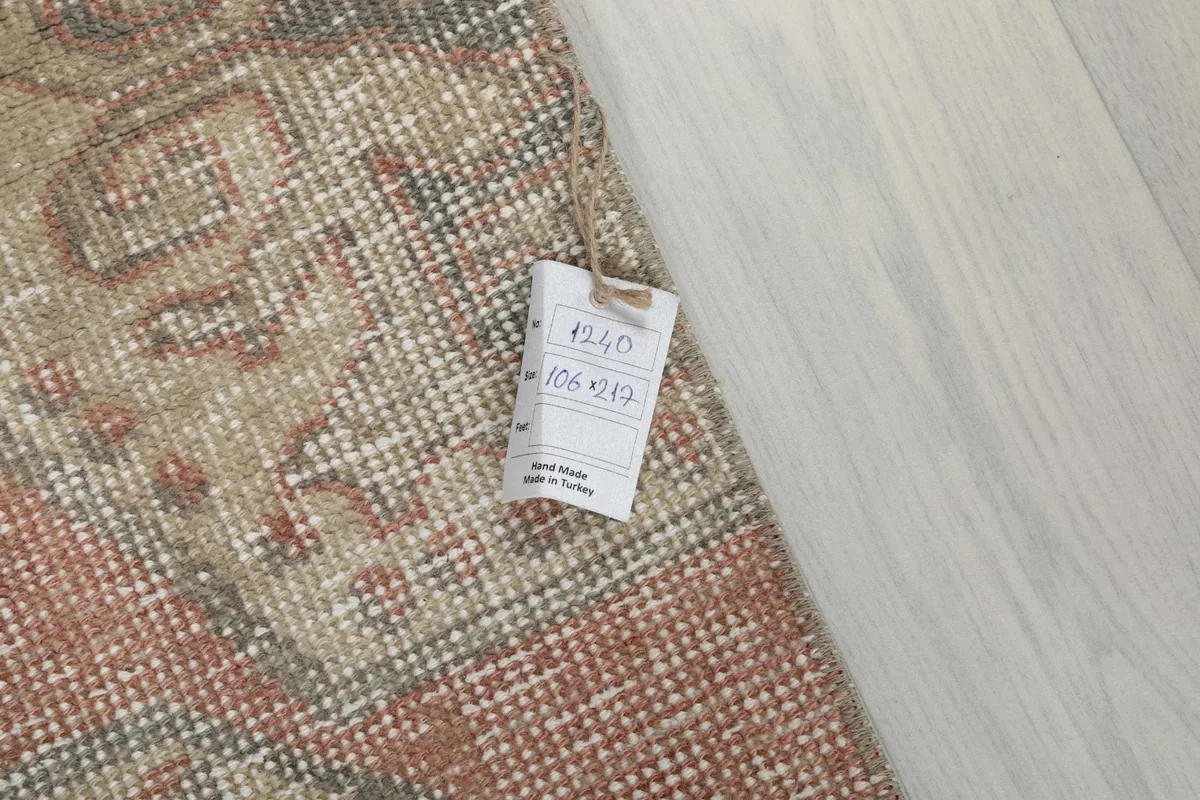 Tag showing the rug's dimensions and origin, confirming it is hand-knotted in Turkey