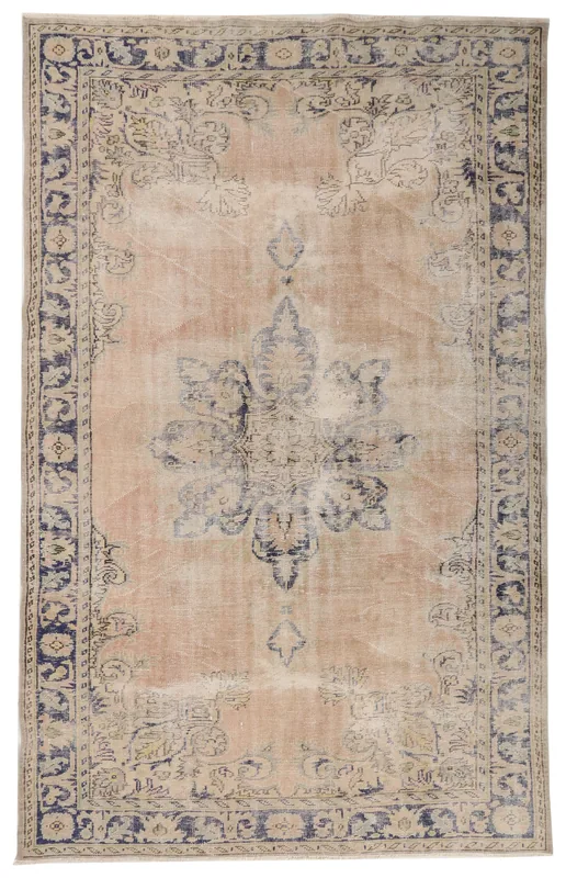 Full overhead view of the 6'10" x 10'6" vintage Anatolian rug with rose field and navy medallion