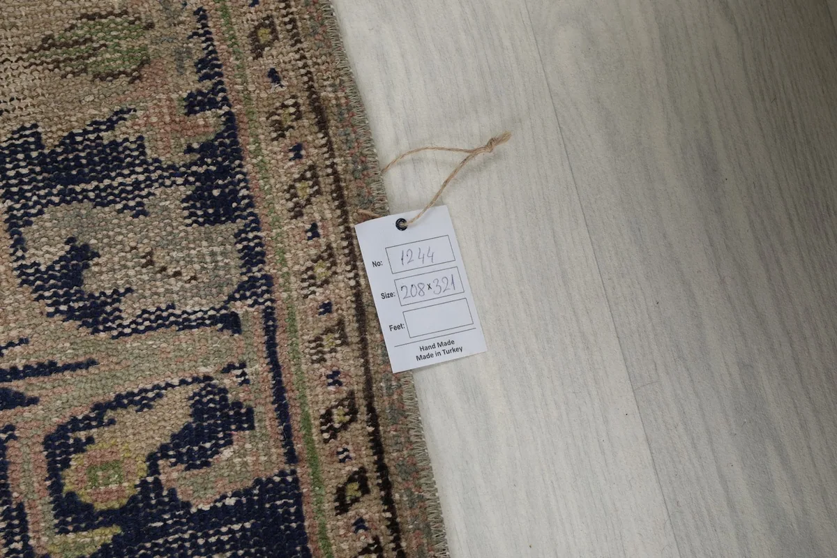 Product tag attached to the rug, displaying size and origin information