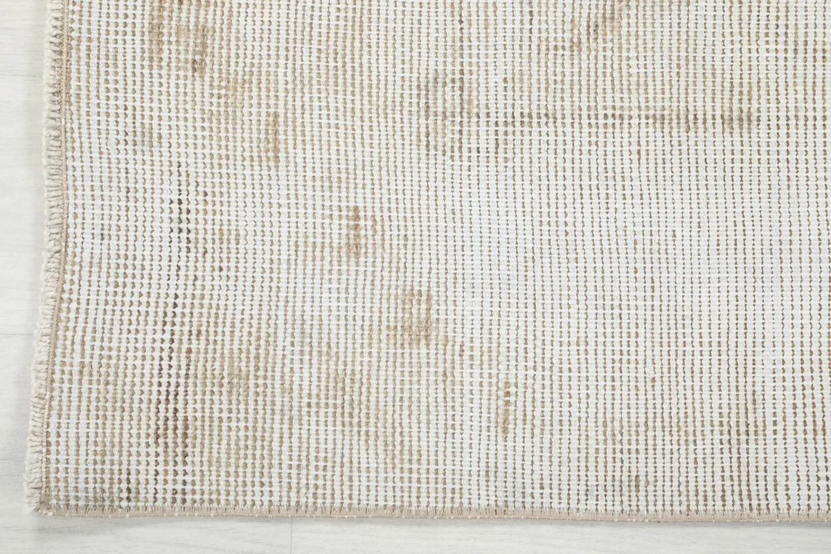 View of the back of the hand-knotted runner rug, showcasing the cotton foundation weave.