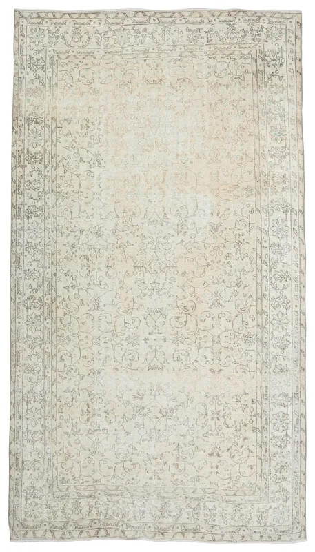 Full overhead view of the 6'7" x 9'10" cream and gray vintage Anatolian rug on a white background.